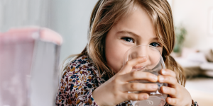 Little girl drinking water